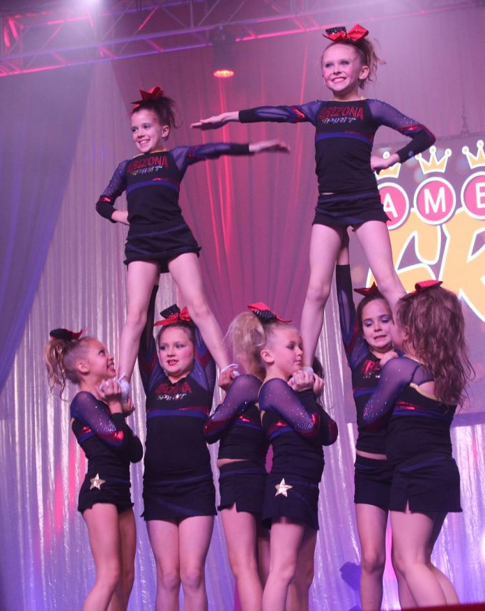 Forming a pyramid are the 7- to 9-year-old girls from the Ruby team during its perfect routine Dec. 13 that garnered it a Superior rating in Las Vegas. The team will next attempt to qualify for the Summit World Championships in Phoenix on Saturday and Sunday, Jan. 16 and 17.