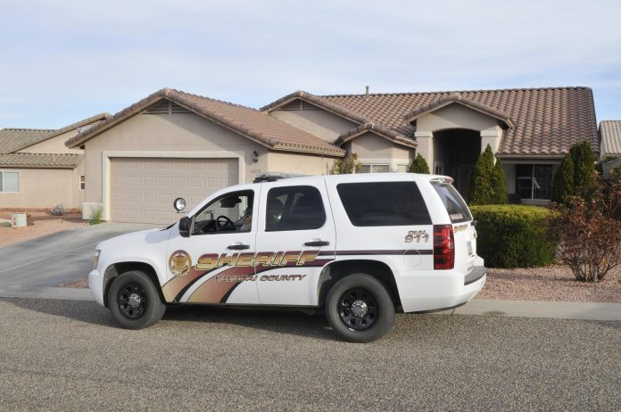 A Yavapai County Sheriff’s Office vehicle waits outside a home at 6250 Distant View Court, where Homeland Security Investigations conducted a search warrant before 7:45 a.m. Thursday, March 3.