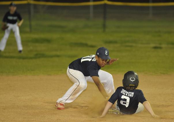Coy Miller of the Camp Verde Braves slides into second base, slightly too late to avoid the tag by Mariners shortstop Corey Johnson. The Mariners won their second straight Majors game of a young Camp Verde Little League season over the Braves, 8-6, April 13.