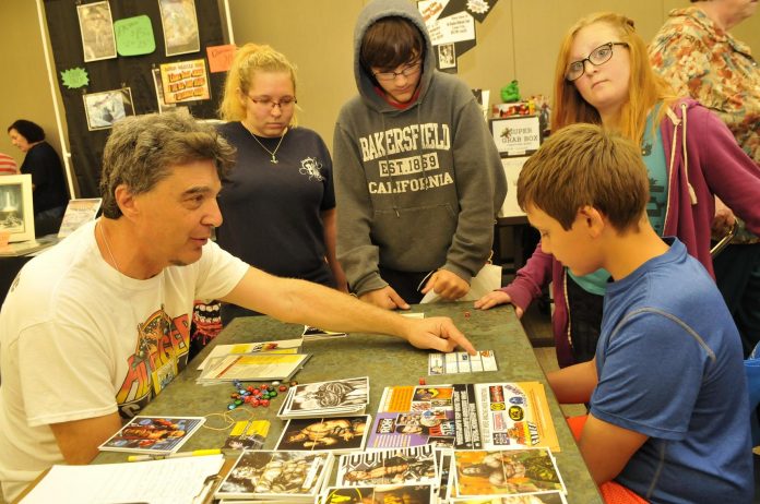 Kids get in on a wrestling card game at the first Verde Valley Comic Expo.