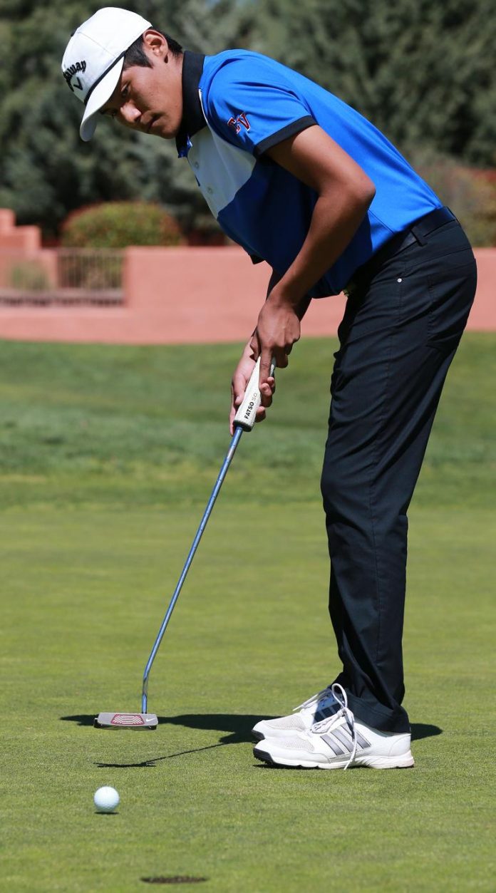 Senior Vance Tewawina, Camp Verde High School’s top golfer, sinks a putt on the second hole of the Oakcreek Country Club in Sedona. Tewawina plans to practice on the course five days a week after tying for 24th at the Division III state golf championships Saturday, May 14.