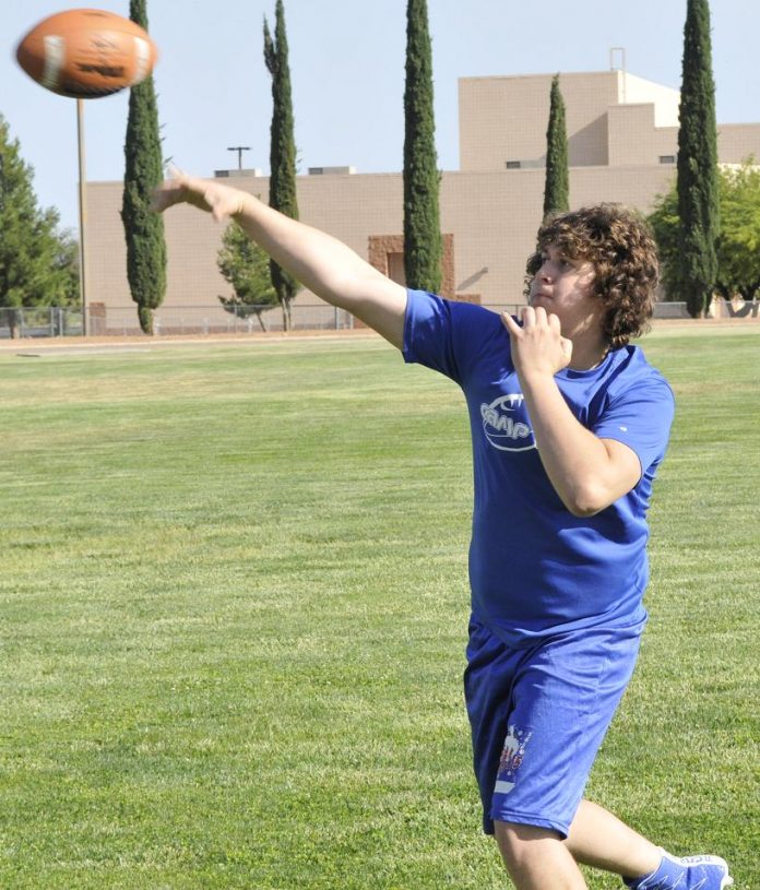 Trey Terry, an incoming Camp Verde High School senior, launches the ball at practice. Terry was the surprise starter at quarterback in place of returning junior starter Payton Sarkesian, throwing four touchdowns in the Cowboys’ first seven-on-seven win June 1 at Tonopah Valley High School.