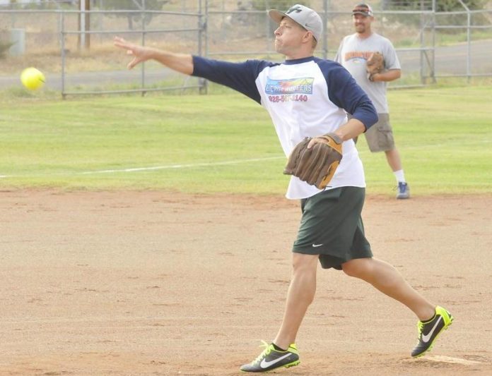 Caleb Kesler, of Melody’s Grooming, pitches to the Mahan Mafia in their game July 20 in the Camp Verde Coed Softball League, presented by the Camp Verde Parks and Recreation Department. Both teams will be looking up to the top-seeded and undefeated Young Guns when playoffs begin Monday, Aug. 1.