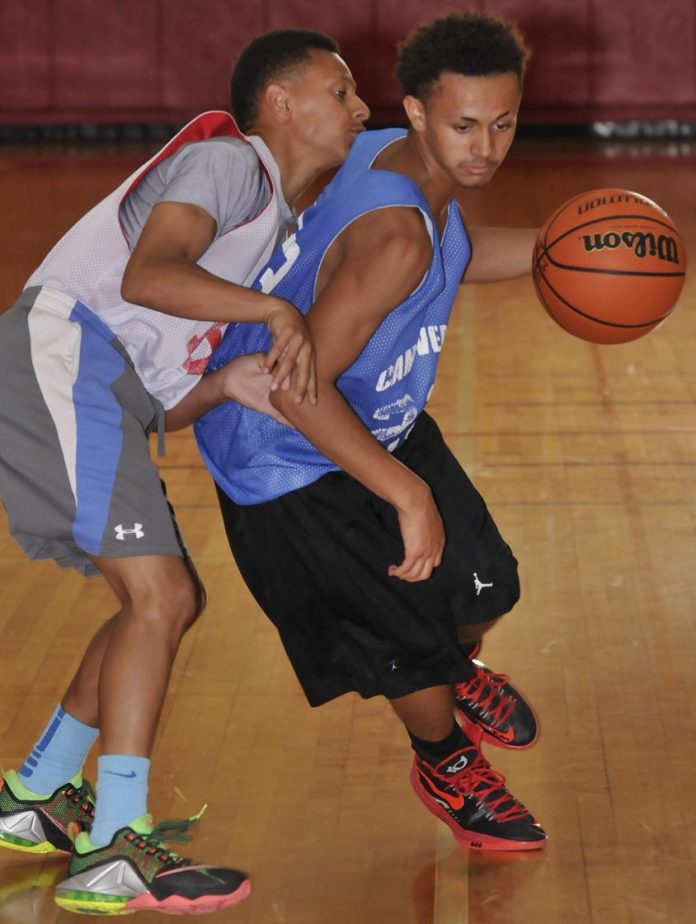 Freshman Teson Parker plans his next move for the Cowboys in a June 14 scrimmage against Bradshaw Mountain High School. Parker and Beaver Creek School teammate Abe Sanchez both challenged for playing time for Camp Verde High School during June games at Mingus Union High School.