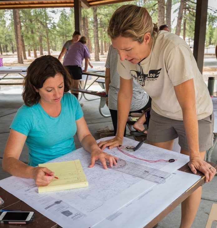 Kande Jacobsen, left, and Nena Barlow practice plotting routes using only a map and compass. They will be competing in the inaugural Rebelle Rally in October. Participants are prohibited from using GPS as they navigate secret roads from Lake Tahoe, Nev., to San Diego, Calif.