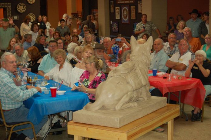 About 144 people attended a benefit barbecue Saturday, July 30, at the Sedona Elks Lodge to raise money for a statue honoring military service dogs. A clay model of the statue was unveiled at the event.