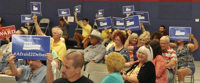 “Why is McCain #Afraid2Debate?” was a question asked by much of the crowd at a U.S. Senate Republican Candidates Town Hall Forum at the American Heritage Academy in Cottonwood. U.S. Sen. John McCain did not attend.