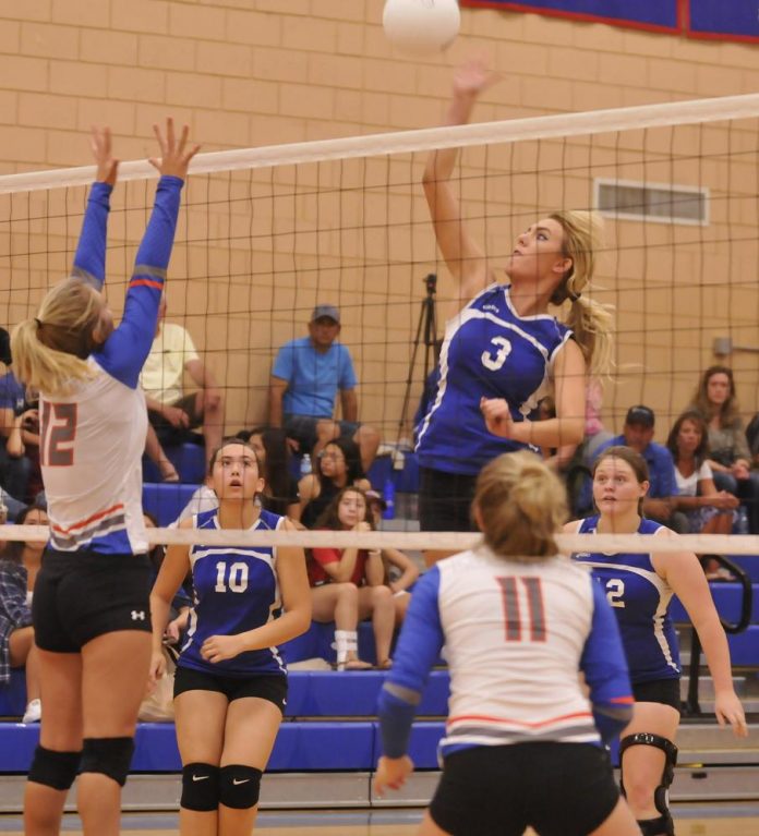 Camp Verde High School senior Shelby Ritzenthaler rises above the net to return a shot from Chino Valley High School last week. After a slow start to the season, the Cowboys beat four teams during a two-day tournament.