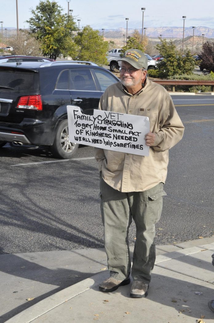 Ron Kidd stands outside a shopping center, hoping someone will offer some help. The Cottonwood City Council voted to donate $2,500 to the Old Town Mission, to implement the One Person, One Night program, that will provide homeless people with motel rooms to prevent exposure during the winter months.