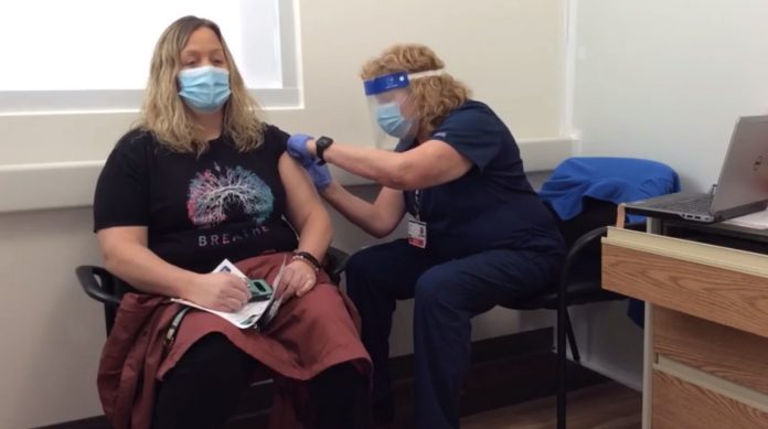 Verde Valley Medical Center radiology technician Erin Gaff was the first person at Verde Valley Medical Center to be vaccinated against COVID-19 on Tuesday, Dec. 22 , followed by several nurses and doctors, with a vaccine developed by the Moderna pharmaceutical company. Screenshot by Jon Hecht/Larson Newspapers