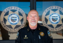Dan Jacobs climbs ladder to top cop