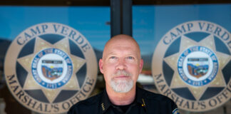 Dan Jacobs climbs ladder to top cop