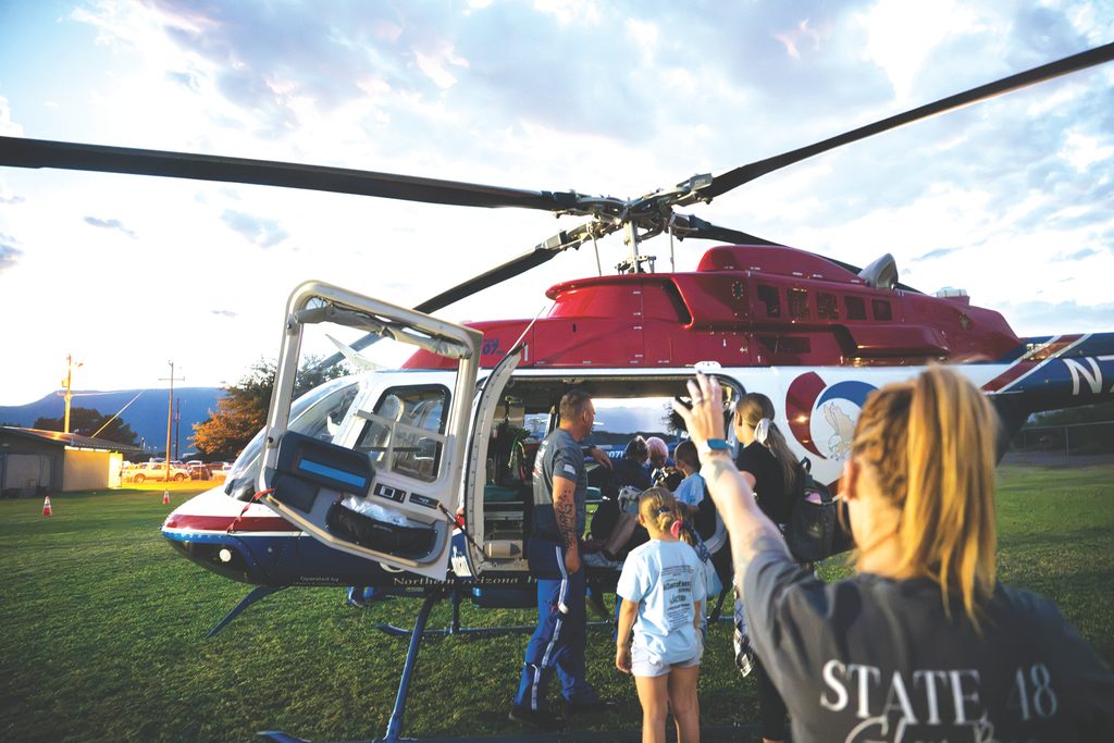 People look at a Guardian Air helicopter during the Cottonwood National Night Out at Cottonwood Kids Park on Wednesday, Oct. 7. [David Jolkovski/Larson Newspapers]